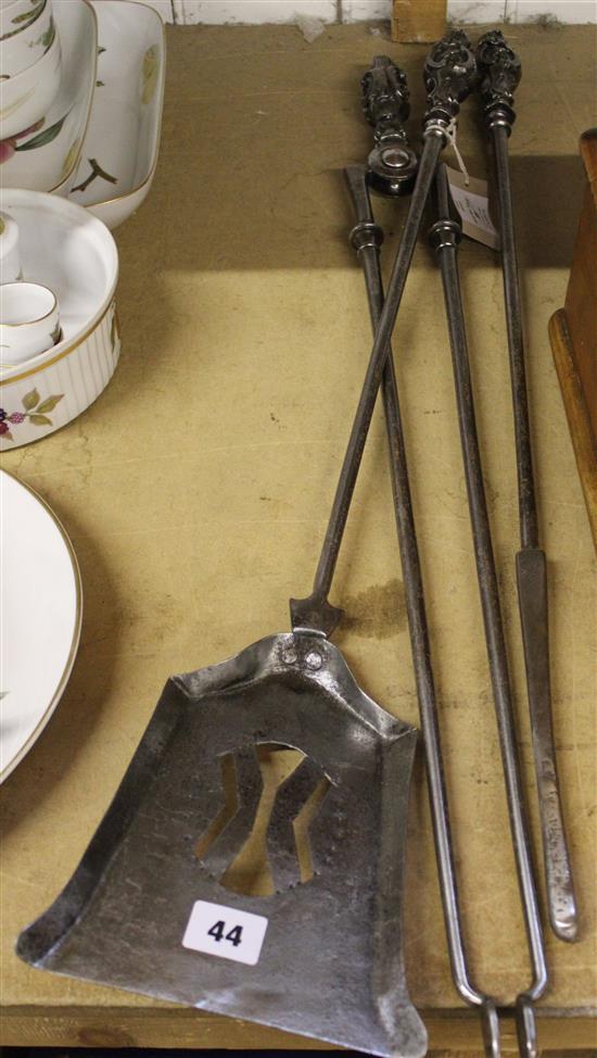 A set of three George III style steel fire irons, shovel 29.5in.